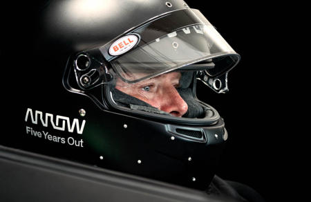 The small white dots on the lower part of the racing helmet connect to infrared cameras mounted on the car's dashboard, which detects Sam's head motions to steer. The response time from Sam's motion to the cars movement is only a few milliseconds.
