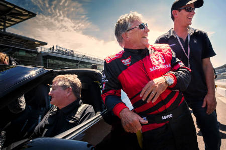 American race car driver Mario Andretti stops in to say hello to Sam after the pair did some demonstration laps at Indianapolis Motor Speedway in 2017. 